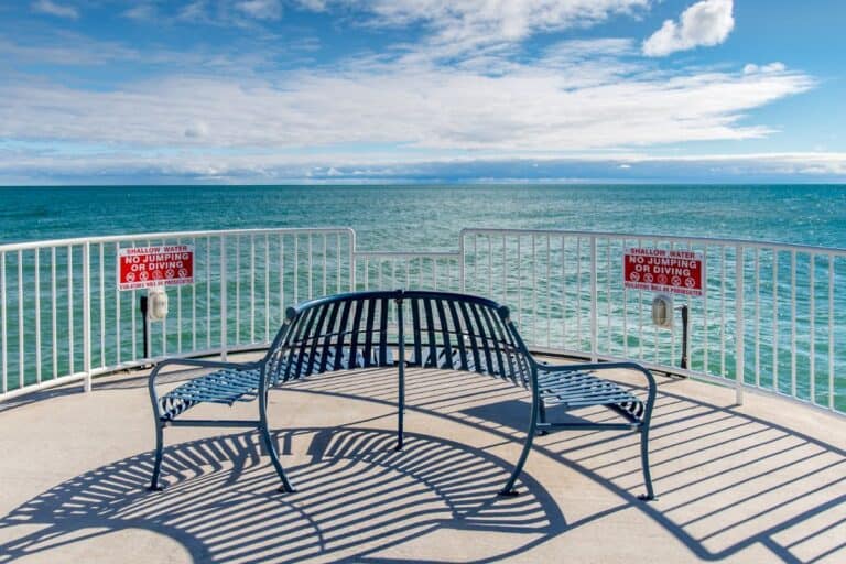 bench on a pier in oscoda mi