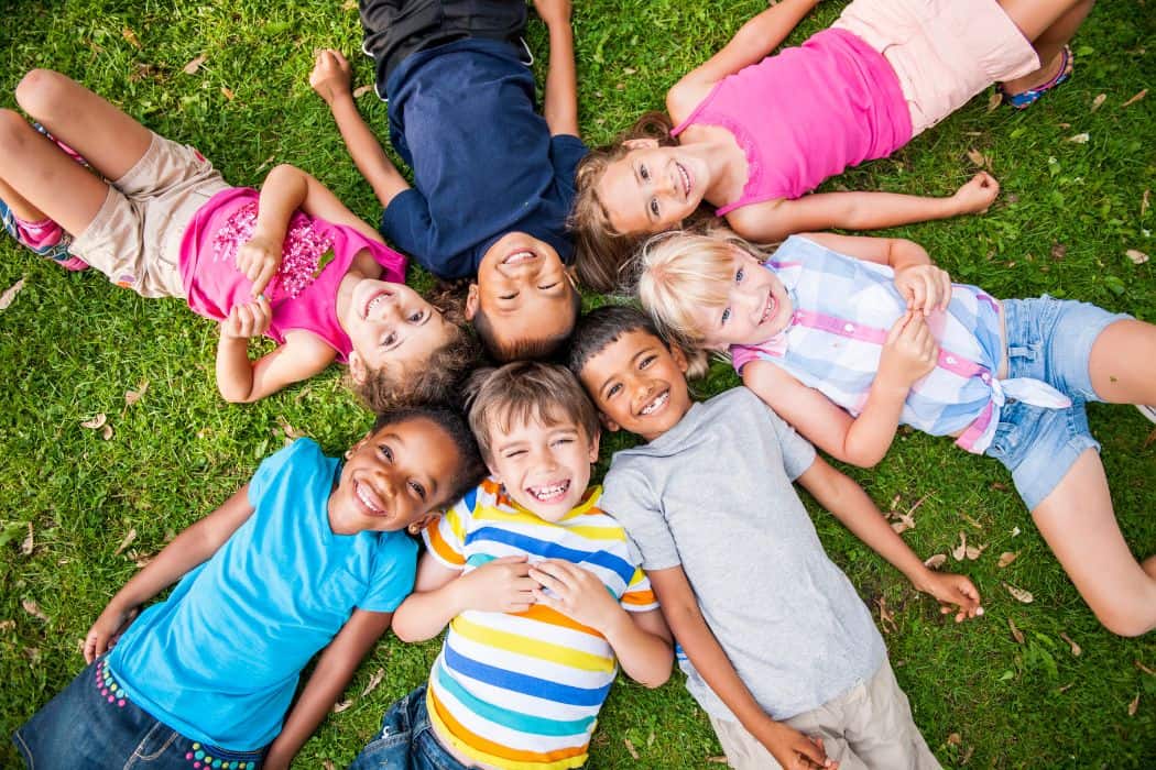 kids in michigan laying on the ground 