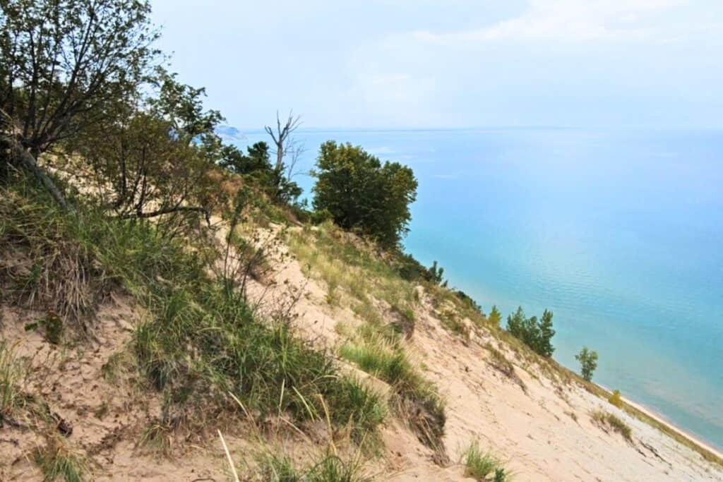 Lake Michigan turquoise water seen from a sandy bluff at Pierce Stocking Scenic Drive in Sleeping Bear Dunes