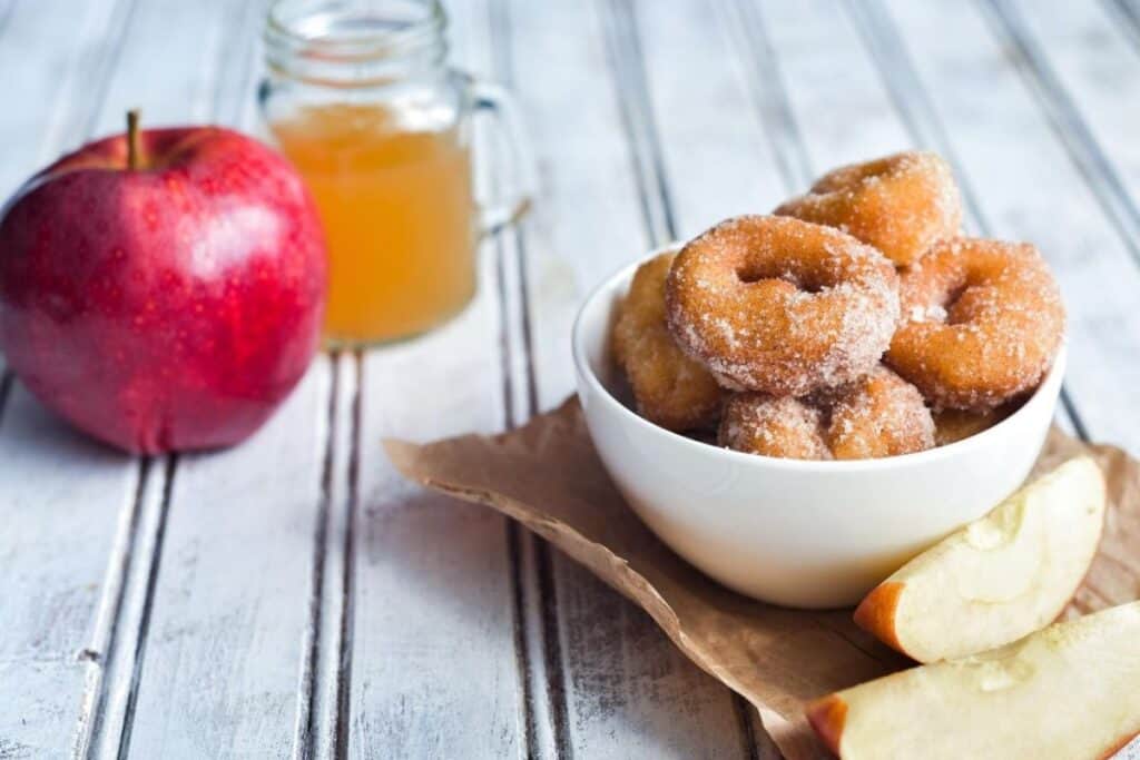 cider and donuts on a table