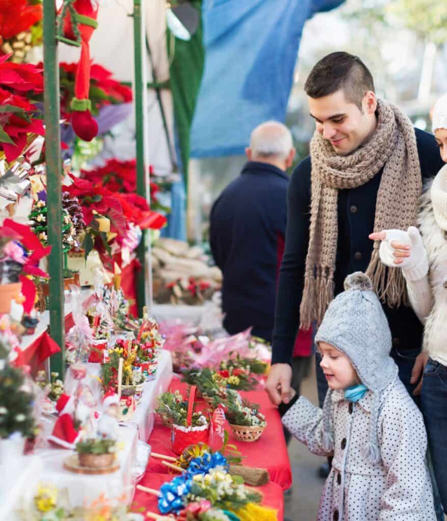 man and child looks at christmas display in michigan 