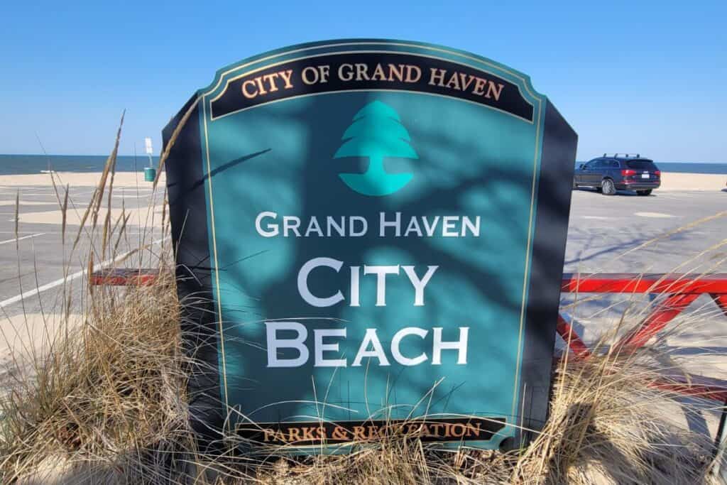 sign for the grand haven city beach