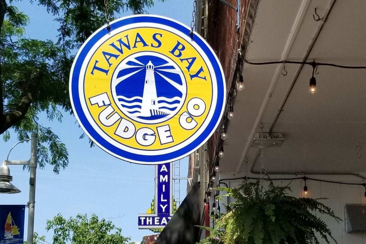 Tawas Bay Fudge sign in downtown East Tawas Michigan near Lake Huron beach town shops