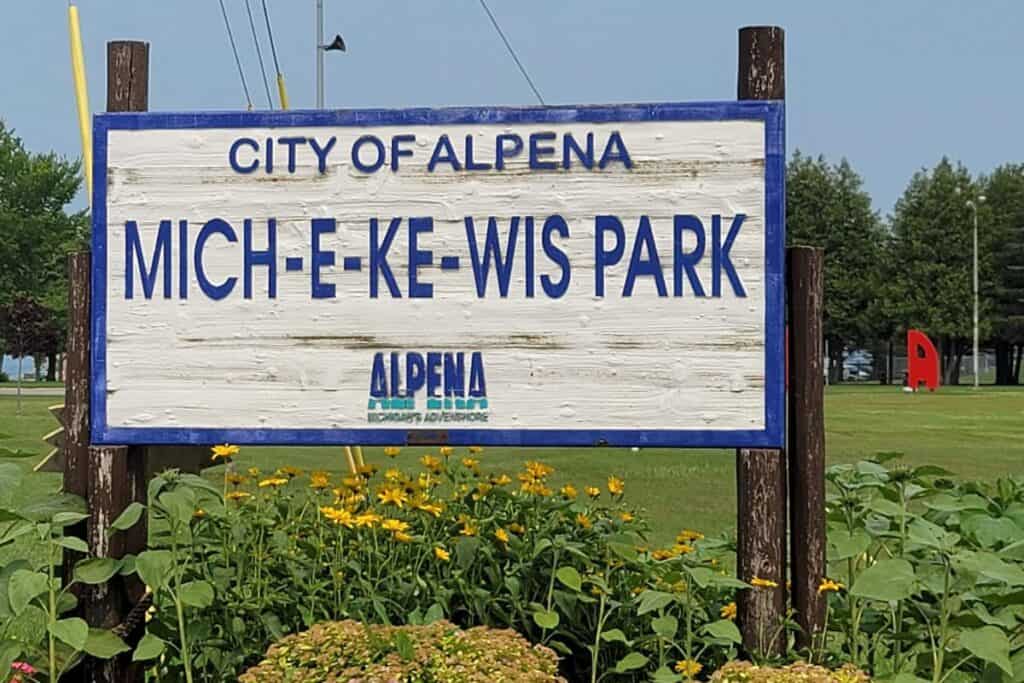 sign for Mich-e-ke-wis park in Alpena Michigan, an ada accessible beach 