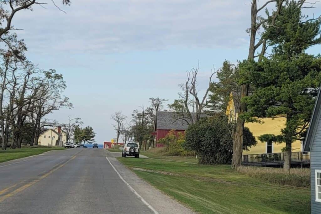 Glen Haven, Michigan: Scenic view of the historic village and beach area with trees and charming hou.