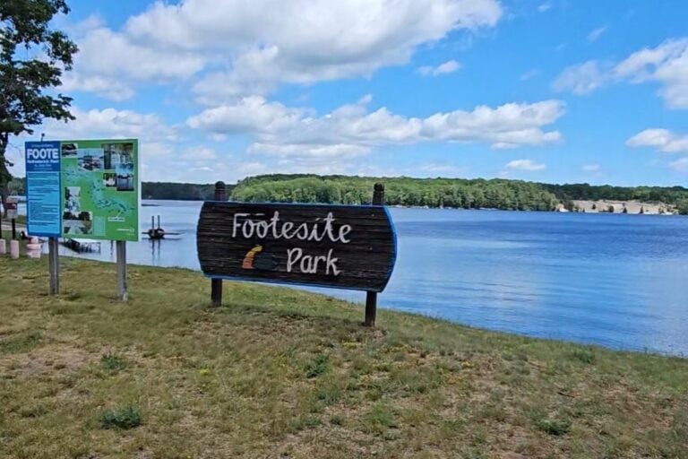 Foote Site Park sign on the Au Sable River dam pond along the River Road Scenic Byway near Oscoda, Michigan