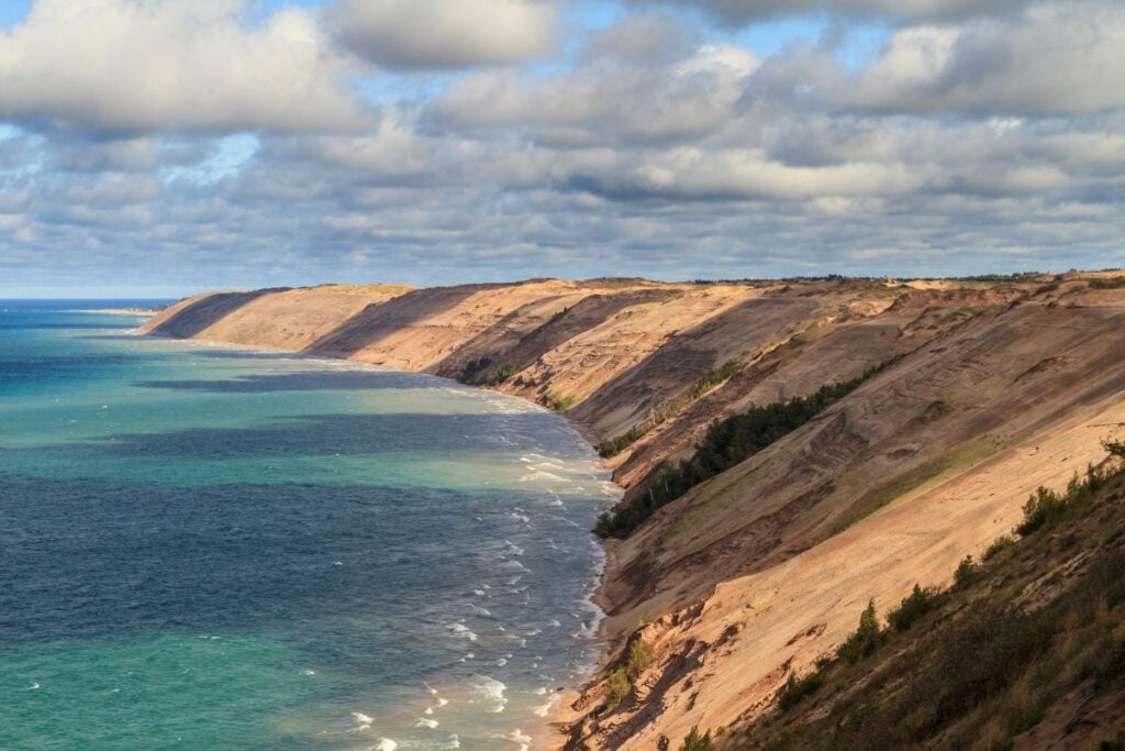 Grand Sable Dunes rising above the turquoise water of Lake Superior at Pictured Rocks National Lakeshore in Michigan's Upper Peninsula