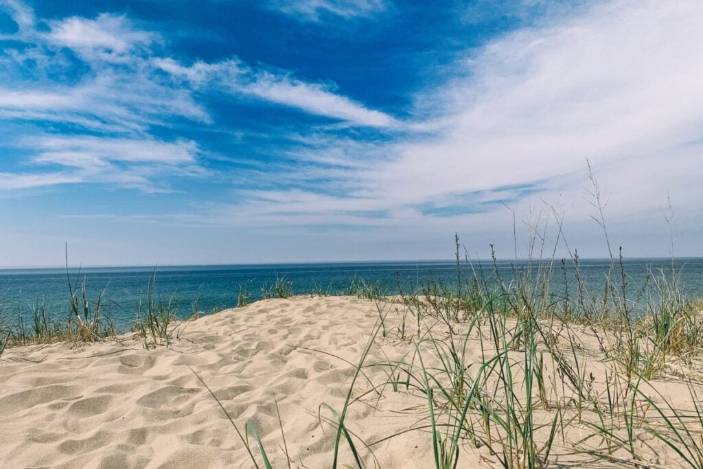 Beach grass on a low sand dune overlooking Lake Huron at Port Crescent State Park near Port Austin, Michigan